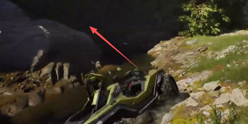 Arrow pointing into the cave beside the river