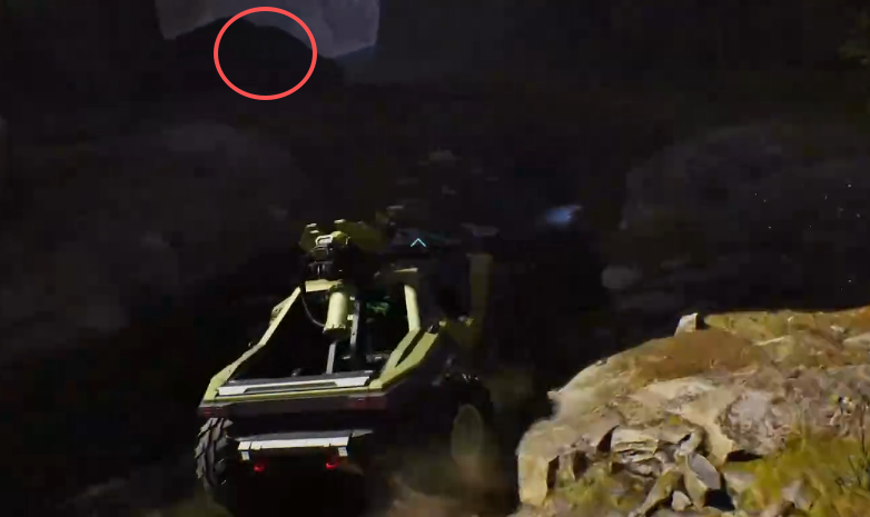 Give and Take skull circled behind the large boulder beside the water