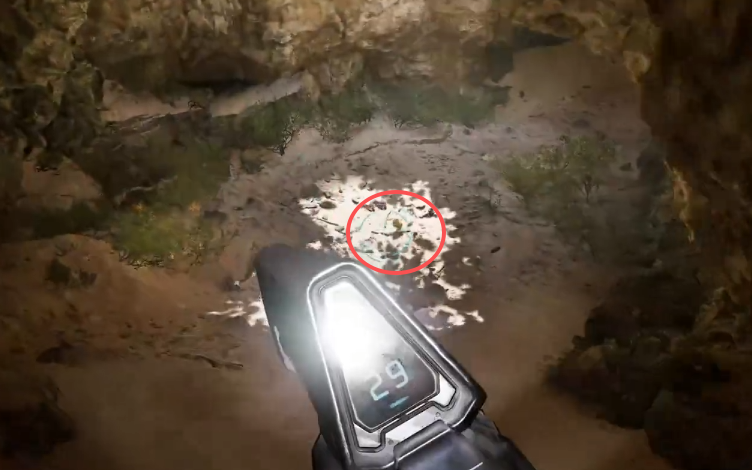 Bandana skull circled on the sandy cave floor